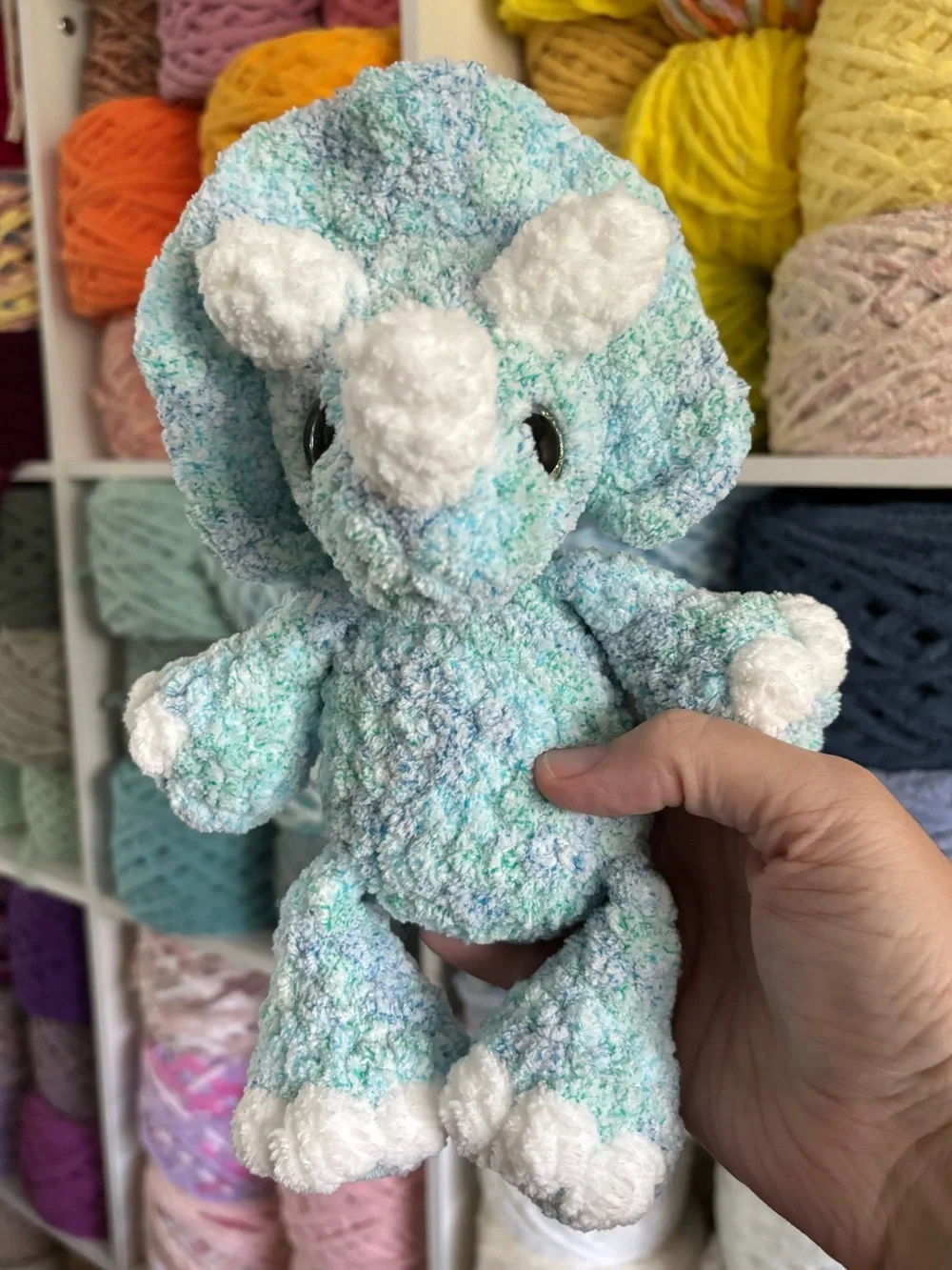 Crochet baby Triceratops plush.